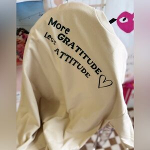 More Gratitude Less Attitude T-Shirt – Sand-Colored Tee with Green Positive Vibe
